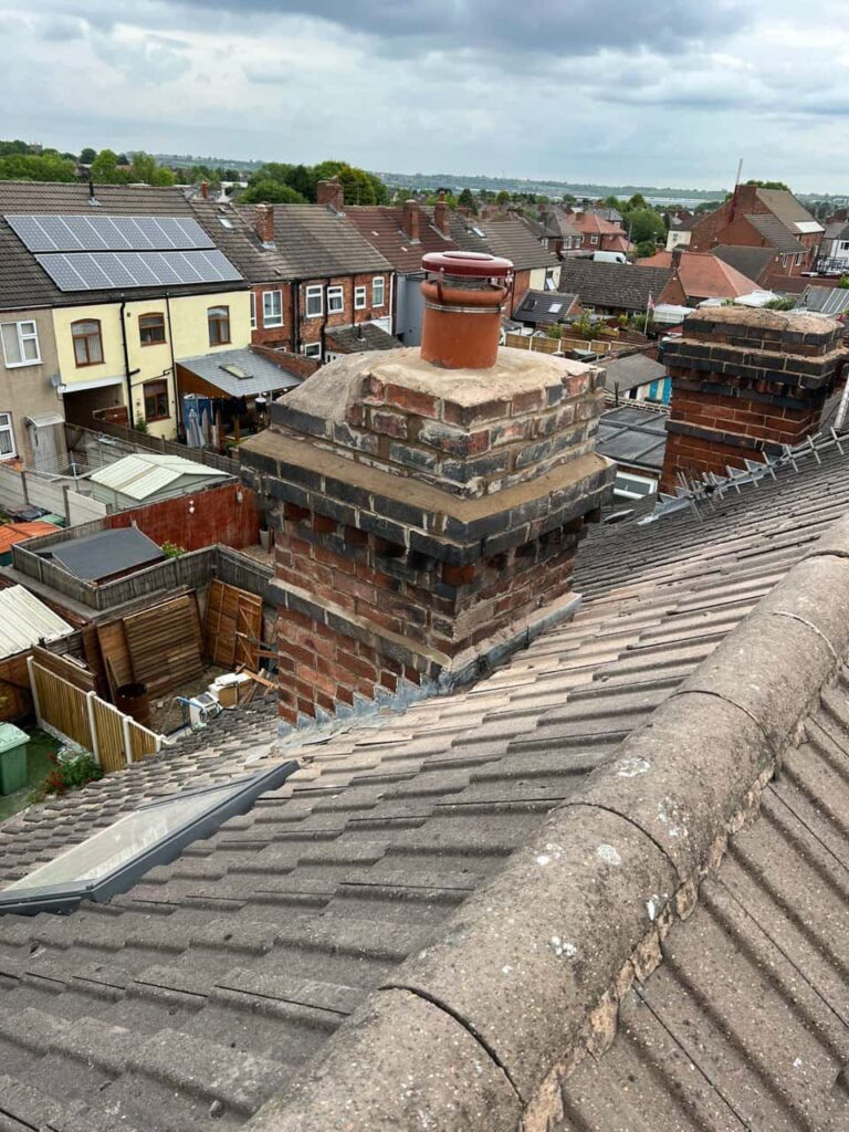 This is a photo taken from a roof which is being repaired by Bilston Roofing Repairs, it shows a street of houses, and their roofs